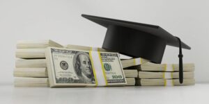 Image of cash and a graduation cap