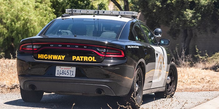 Photograph of a California Highway Patrol car on the side of a road.