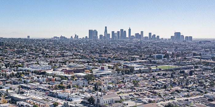 Photograph of downtown Los Angeles skyline during the day.