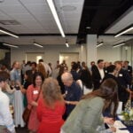 People mingling before the program