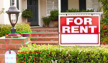 Sign says "FOR RENT" in front of a house
