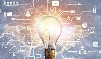 Illustration shows a glowing glass bulb with many shapes around it, including a key, various charts, email, silhouettes, and more.