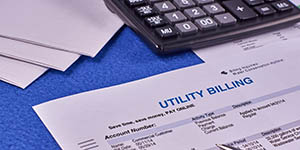 Photo of a utility bill and a calculator