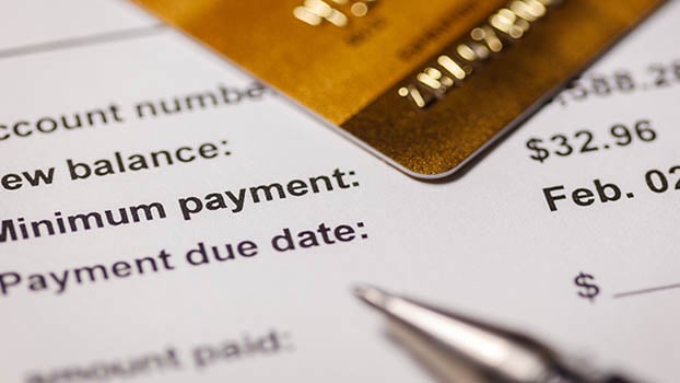 Photo of a credit card and credit card bill