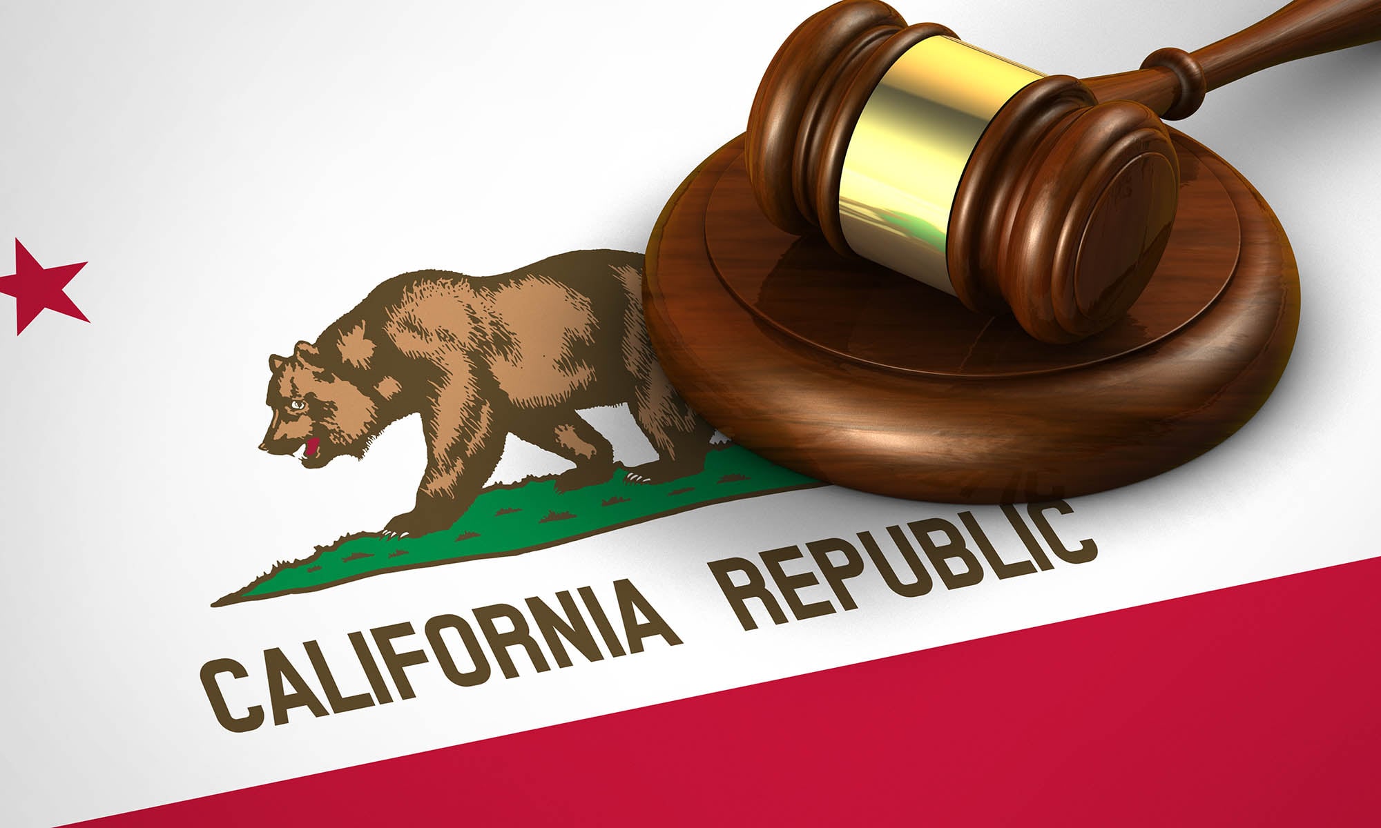 Photo of a judge's gavel on top of the California flag