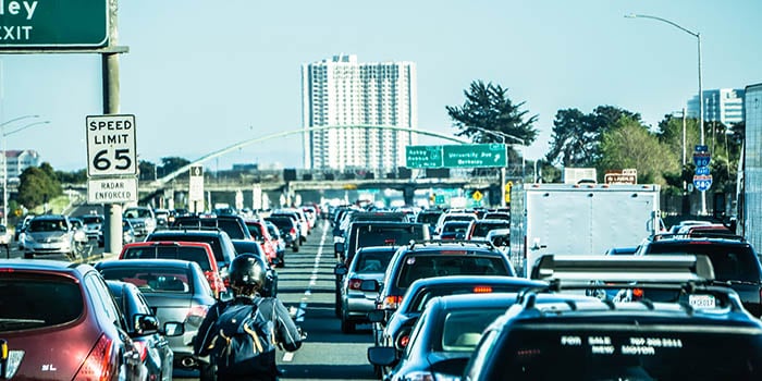 Photograph of a highway with many cars on it, in Oakland, California
