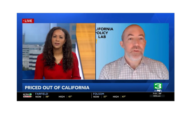 Screenshot of TV interview shows TV anchor Brandi Cummings and Evan White speaking with each other.